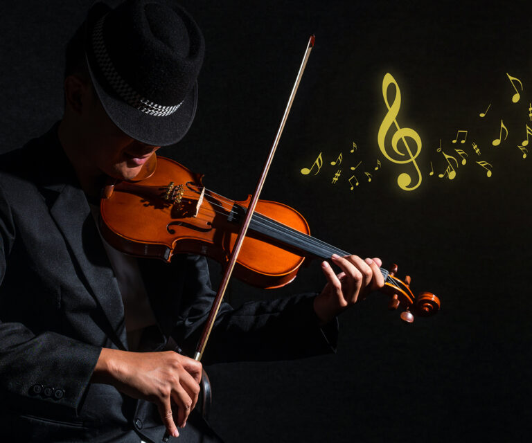 Violin player in dark studio with music notes, Musical concept